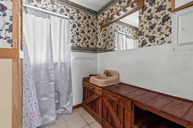 bathroom featuring tile patterned flooring, tile walls, and vanity