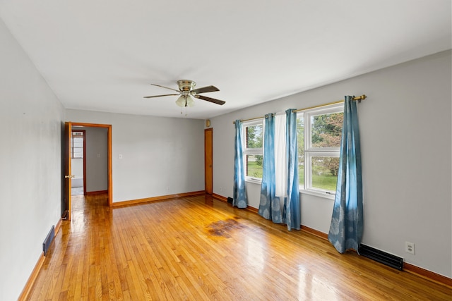 unfurnished room featuring ceiling fan and light hardwood / wood-style floors