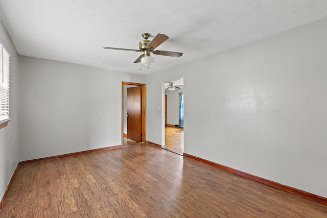 spare room featuring a textured ceiling, hardwood / wood-style floors, and ceiling fan