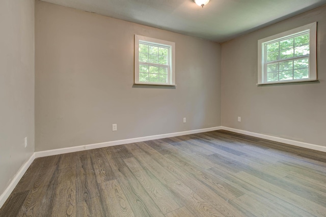 empty room with light hardwood / wood-style flooring