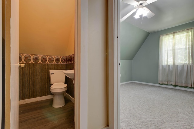 bathroom featuring ceiling fan, toilet, and lofted ceiling