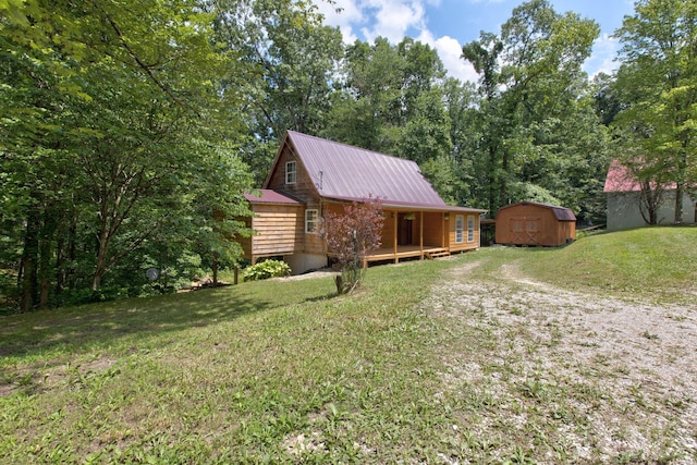 exterior space with a yard and a storage shed