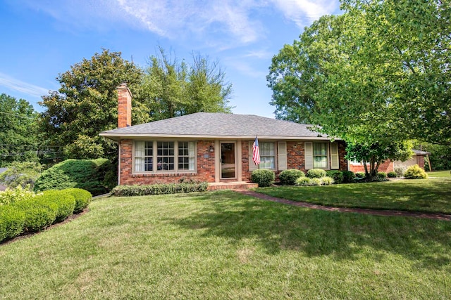 single story home featuring a front yard