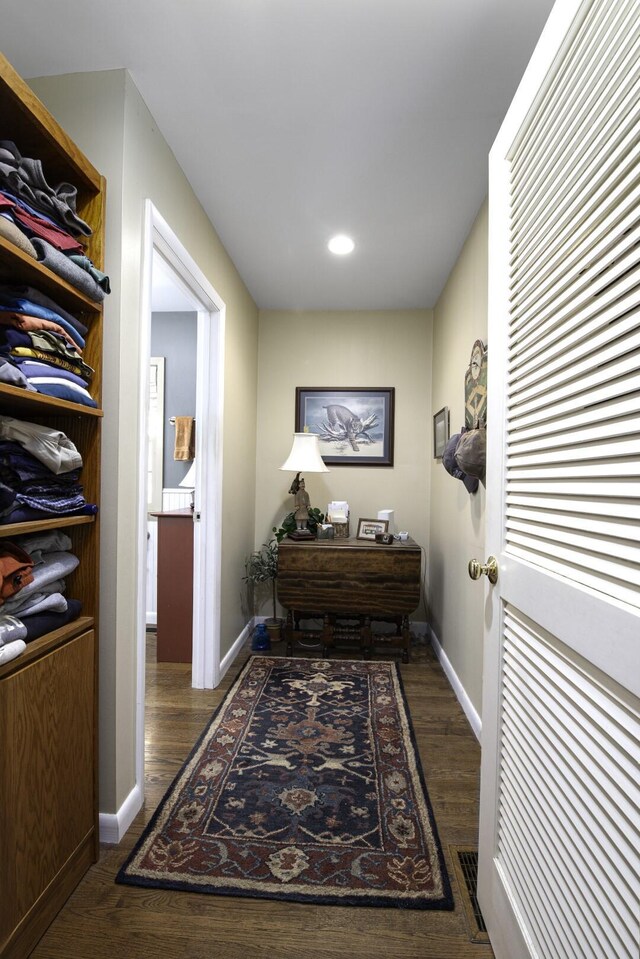 hall with dark hardwood / wood-style floors