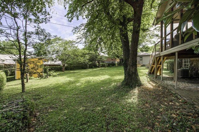 view of yard with central AC