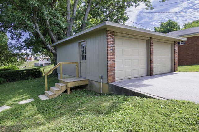 garage with a lawn