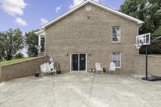 back of property with a patio