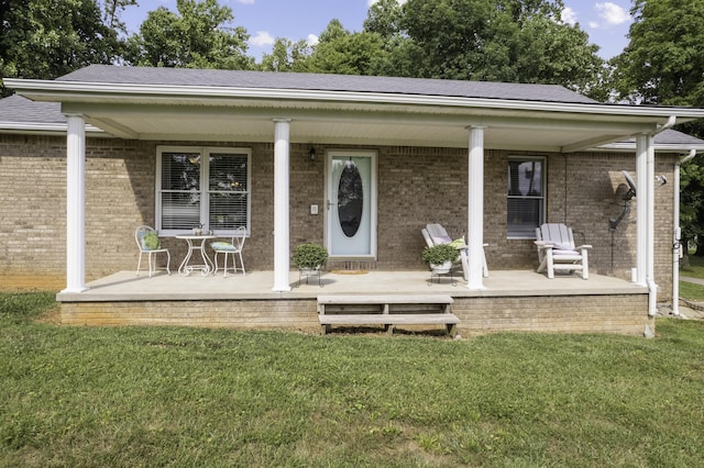 exterior space with a yard and covered porch