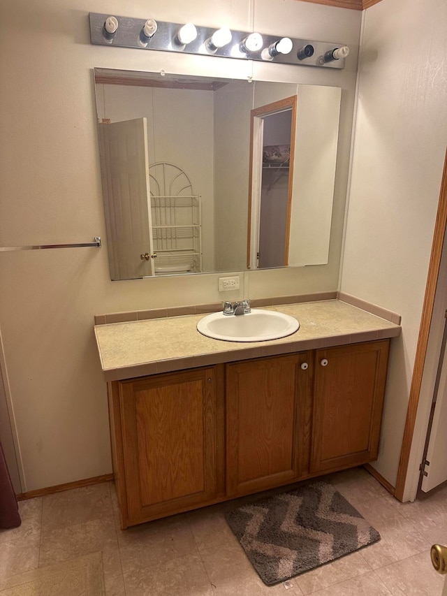 bathroom with vanity and tile patterned floors