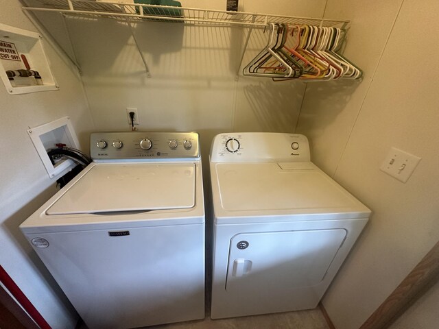 washroom with washer and dryer