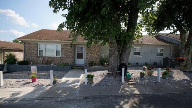 view of front of house featuring central air condition unit