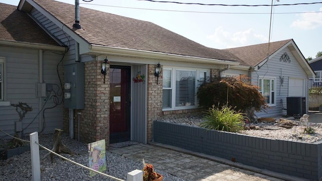 view of property exterior with a garage and central AC