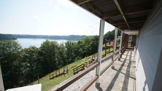 balcony featuring a water view