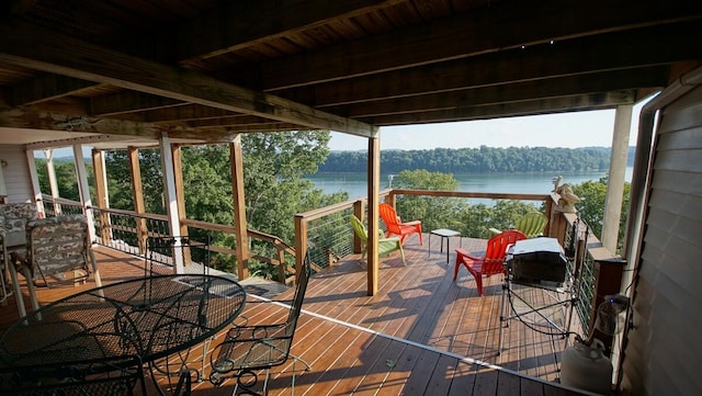 wooden deck with a water view