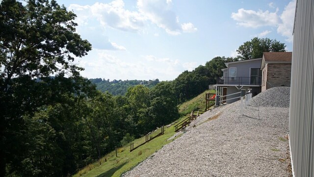 view of yard with a balcony