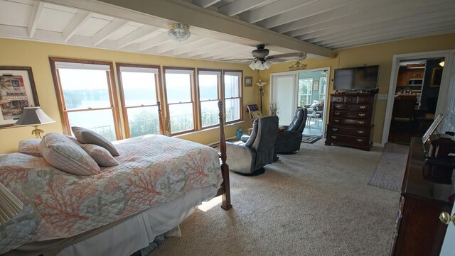 carpeted bedroom with beamed ceiling and ceiling fan