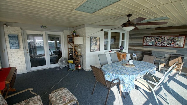 interior space with ceiling fan