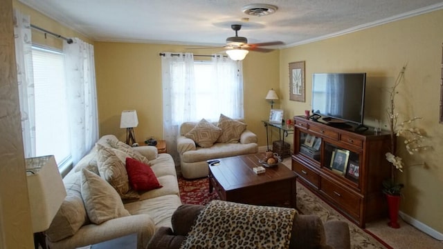 living room featuring crown molding and ceiling fan