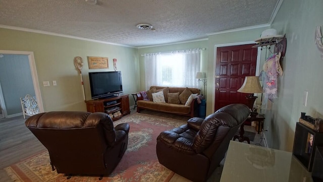 living room with ornamental molding, a textured ceiling, and hardwood / wood-style flooring