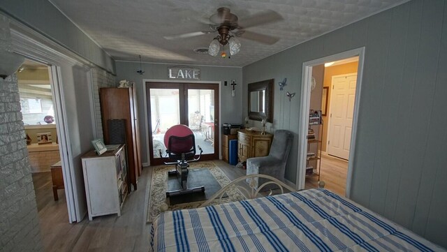 bedroom featuring ceiling fan and hardwood / wood-style floors