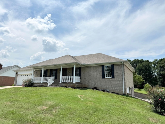 ranch-style house featuring a porch, a garage, and a front lawn