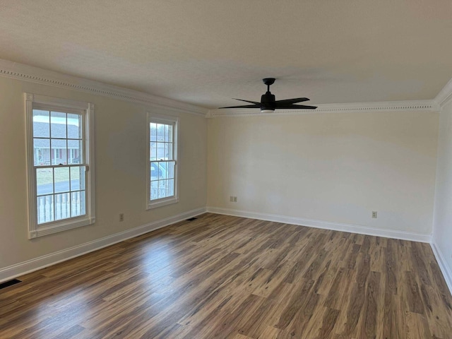 unfurnished room with ceiling fan, ornamental molding, dark hardwood / wood-style flooring, and a textured ceiling