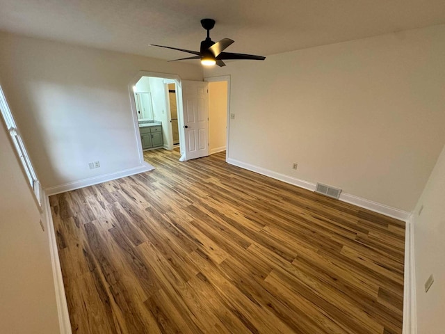 empty room with hardwood / wood-style flooring and ceiling fan