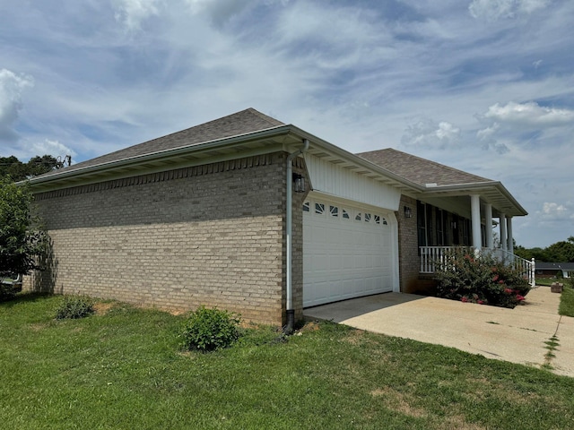 view of home's exterior featuring a porch, a garage, and a lawn