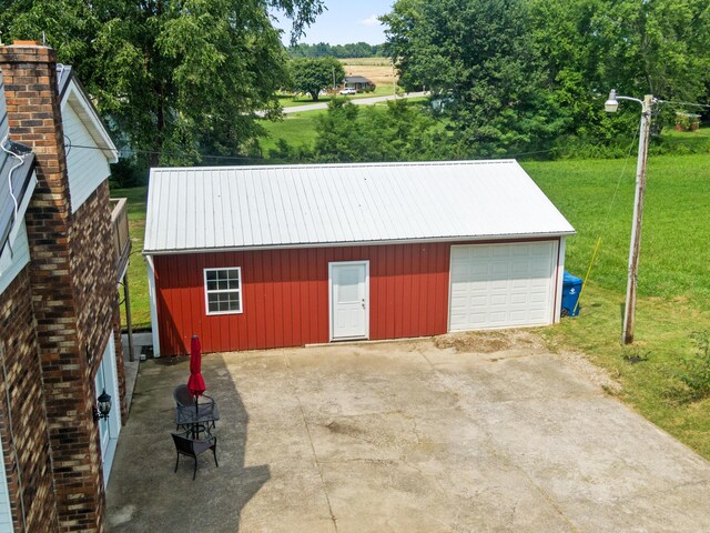 garage featuring a yard