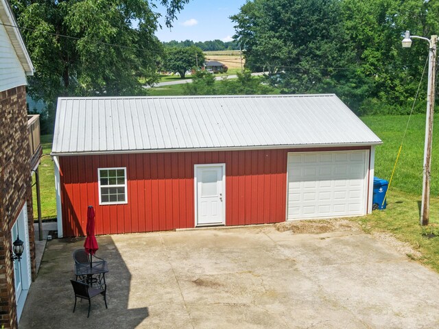 garage featuring a yard