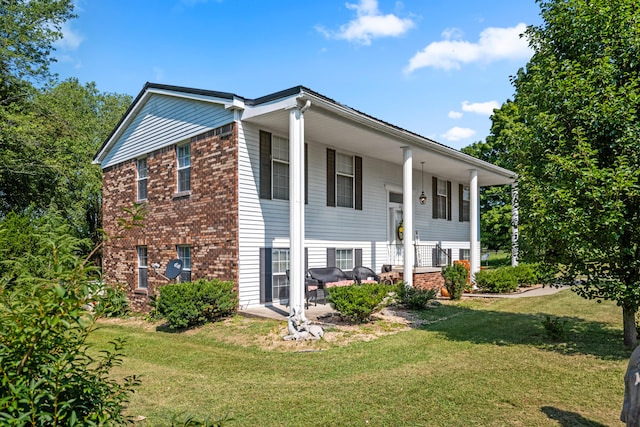 bi-level home with a front lawn