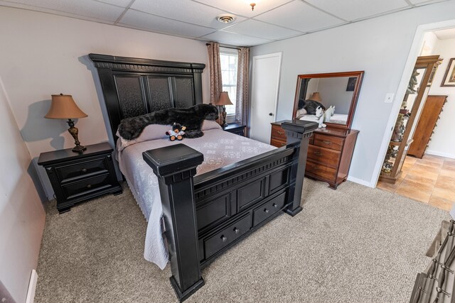 tiled bedroom with a drop ceiling