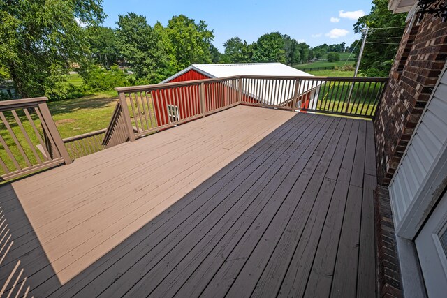 wooden deck with a lawn