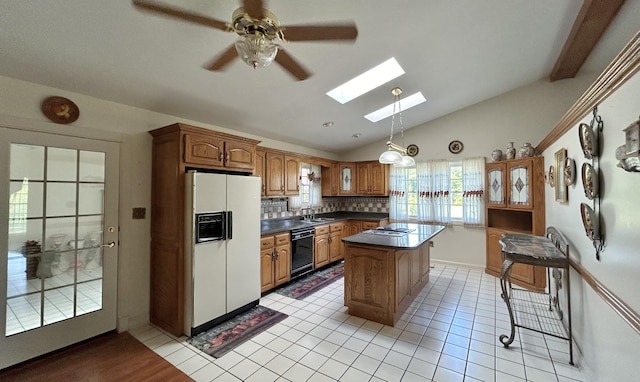 kitchen featuring sink, a center island, dishwasher, a kitchen bar, and white fridge with ice dispenser