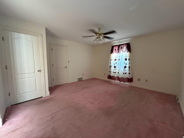 empty room with carpet floors and ceiling fan