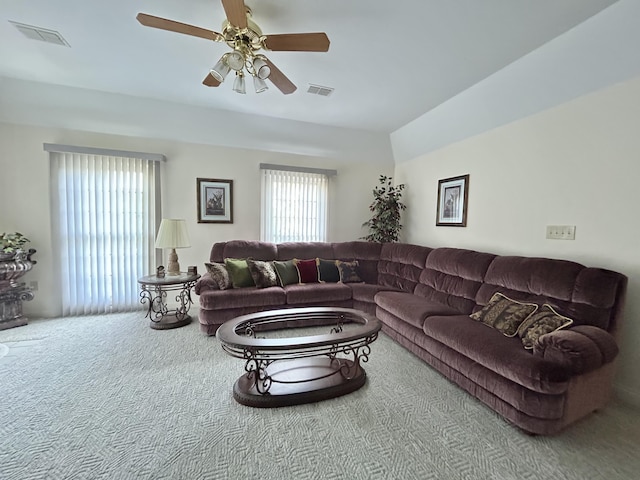 living room featuring carpet flooring and ceiling fan