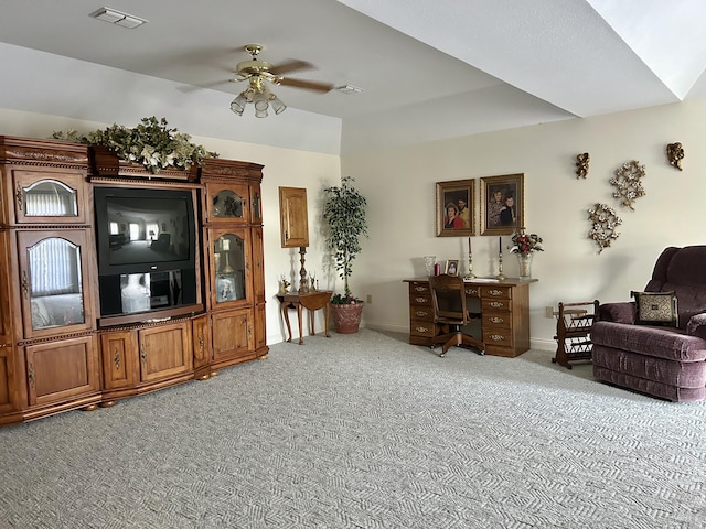 carpeted living room featuring ceiling fan