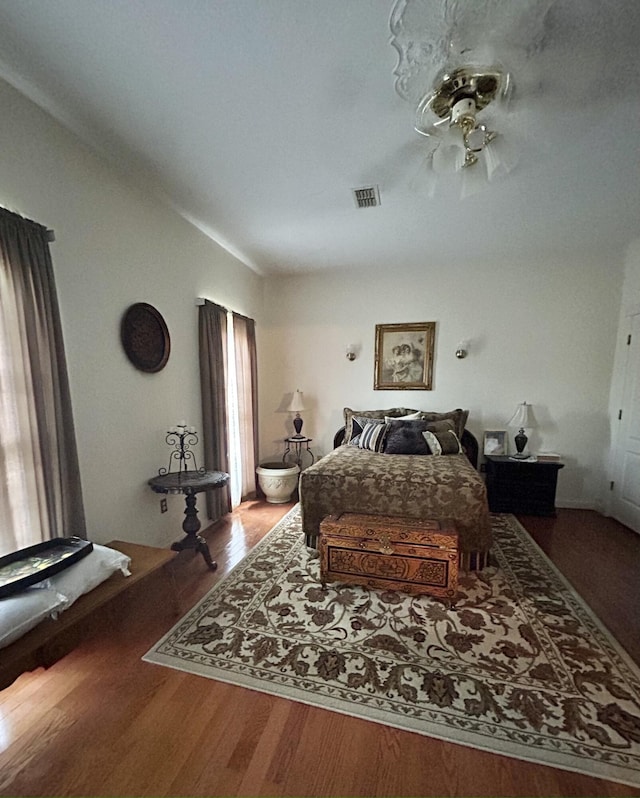 bedroom with hardwood / wood-style floors