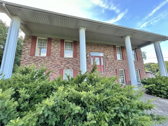 view of property exterior featuring a porch