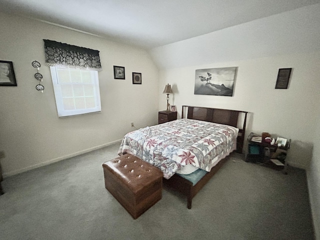 carpeted bedroom with lofted ceiling