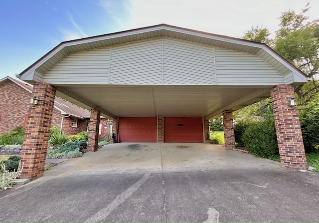 view of parking / parking lot with a garage