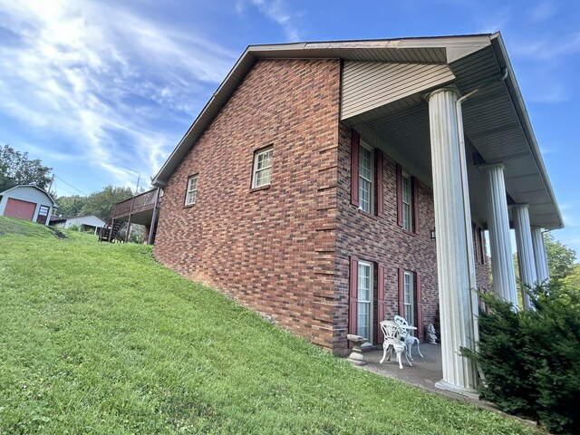 view of side of property featuring a yard