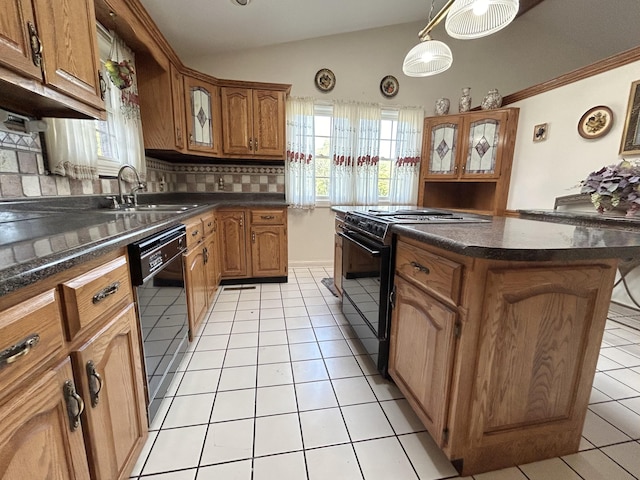 kitchen featuring sink, pendant lighting, backsplash, a kitchen island, and black appliances