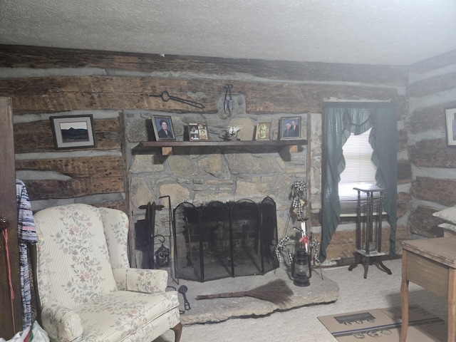 carpeted living area with a textured ceiling and a fireplace