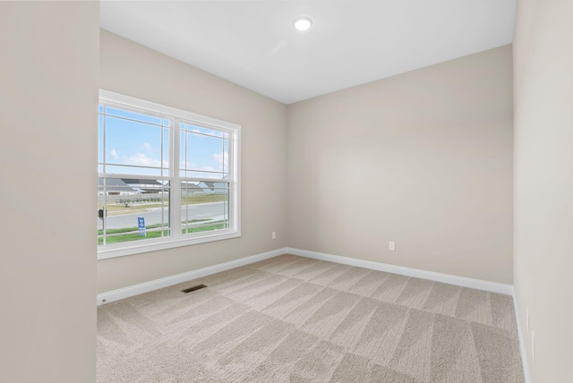 view of carpeted spare room