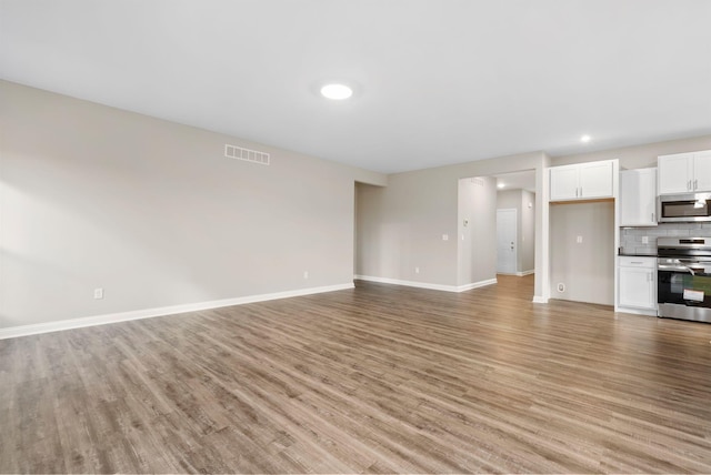 unfurnished living room featuring light hardwood / wood-style flooring