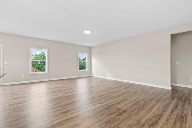 empty room featuring hardwood / wood-style floors