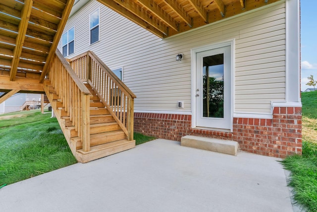 doorway to property featuring a patio area