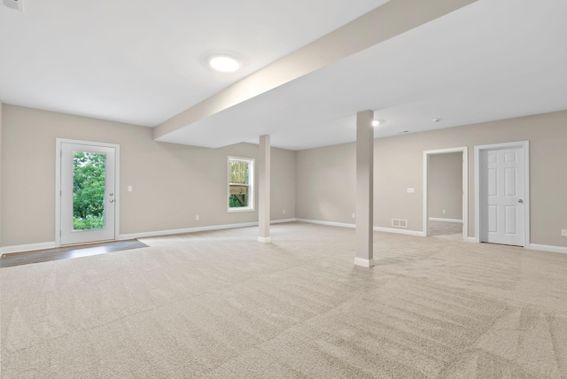 interior space with light carpet and plenty of natural light