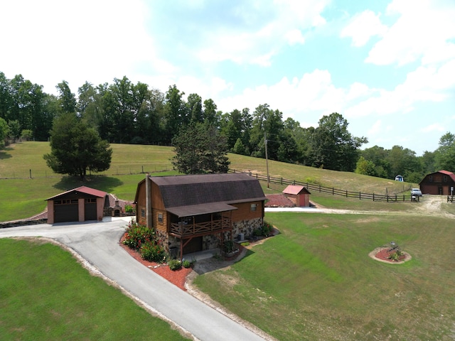 birds eye view of property with a rural view